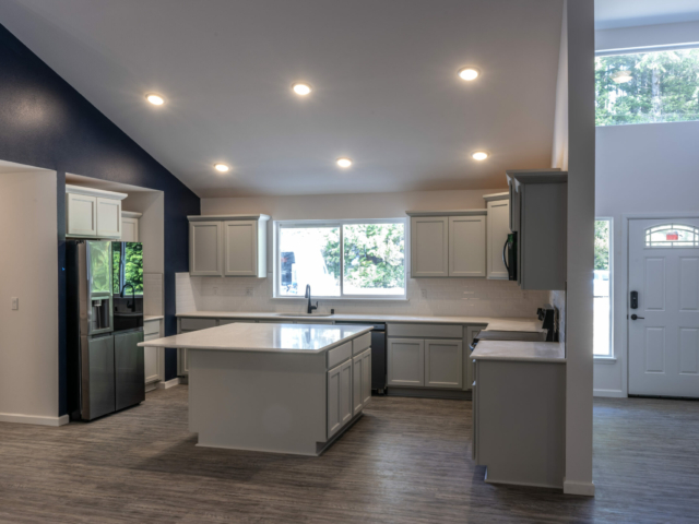 horshoe-bay-custom-home-reality-homes-3 Horseshoe Bay 1 Story Custom Home Kitchen with Island and Entry Way